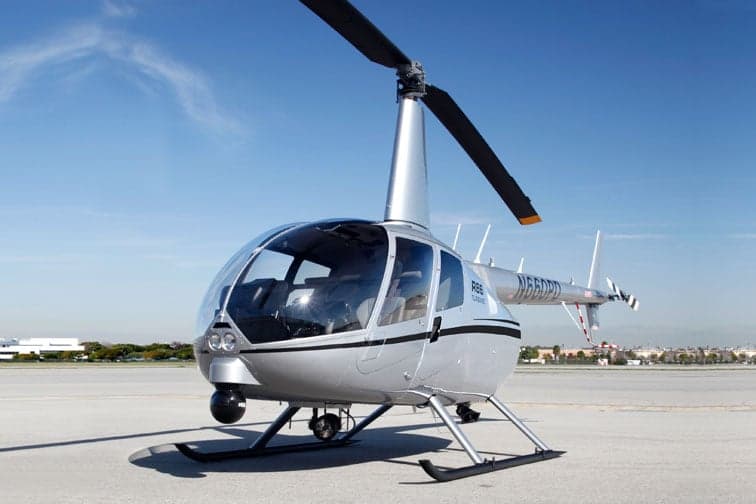 Marketing photo of a Robinson R66 Turbine police helicopter in flight.