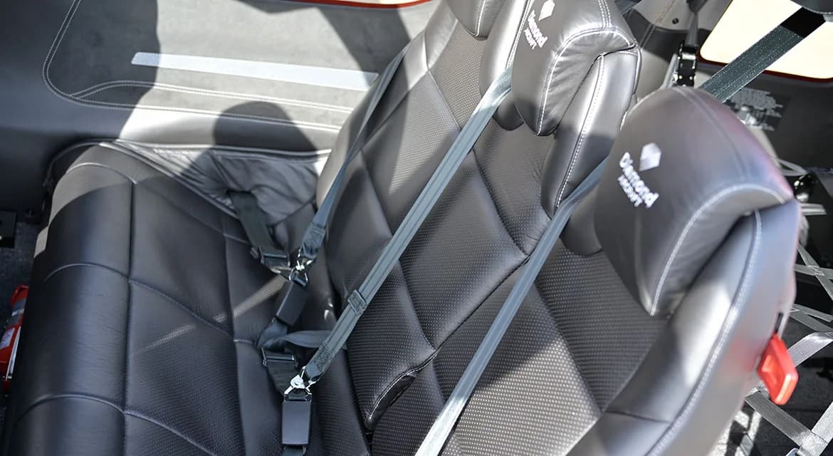The interior of the Diamond DA62 features black leather seats with Diamond Aircraft logos.