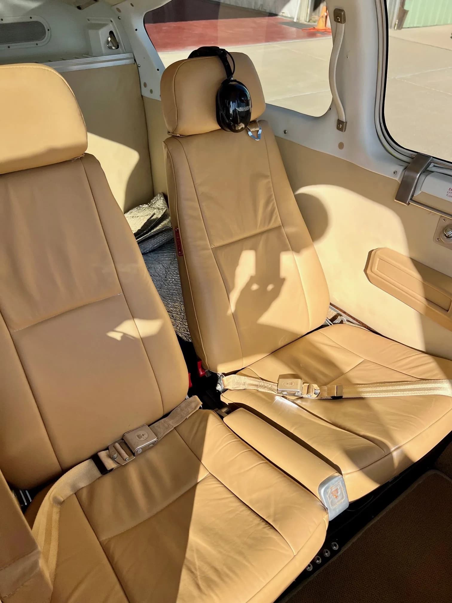 View of the aircraft's tan leather seats and interior cabin.