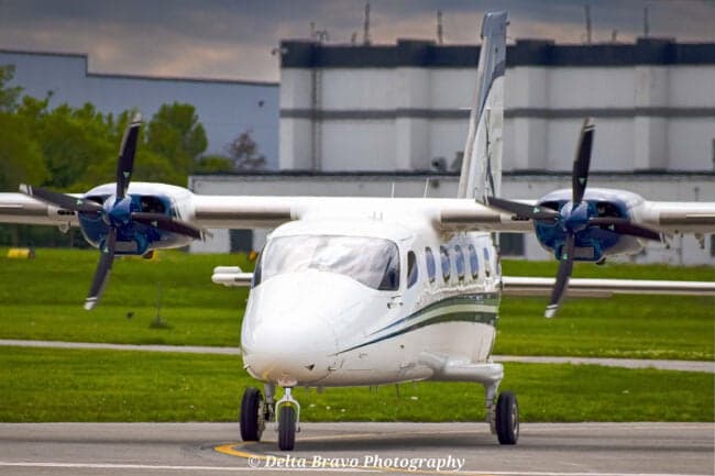 The interior of a Tecnam P2012 Traveller with Cape Air branded seats.