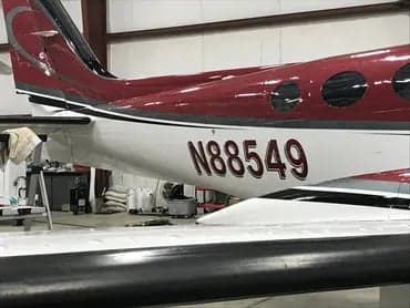 The tail section of the Cessna 340A aircraft with the tail number N88549 is shown.
