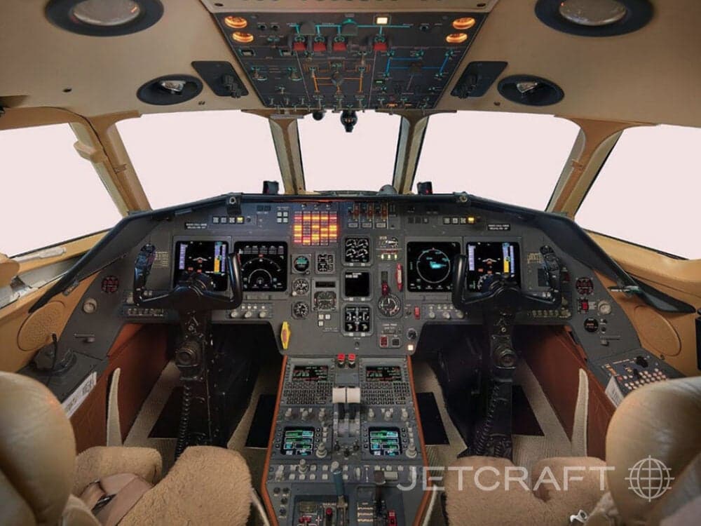 Aircraft cockpit with instrument panel and controls.