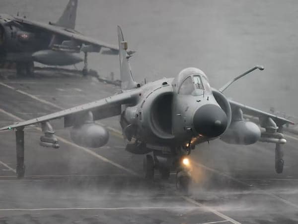 Harrier jet on the deck of an aircraft carrier.