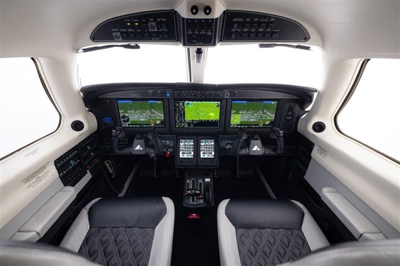 View of the cockpit of a Piper M600 SLS aircraft with modern avionics.