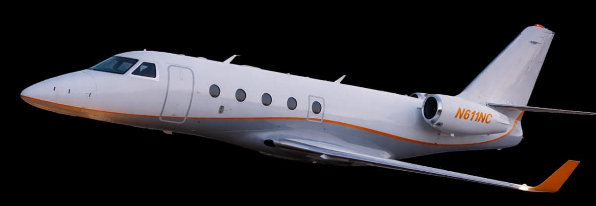 A white jet with orange accents is shown against a black background.