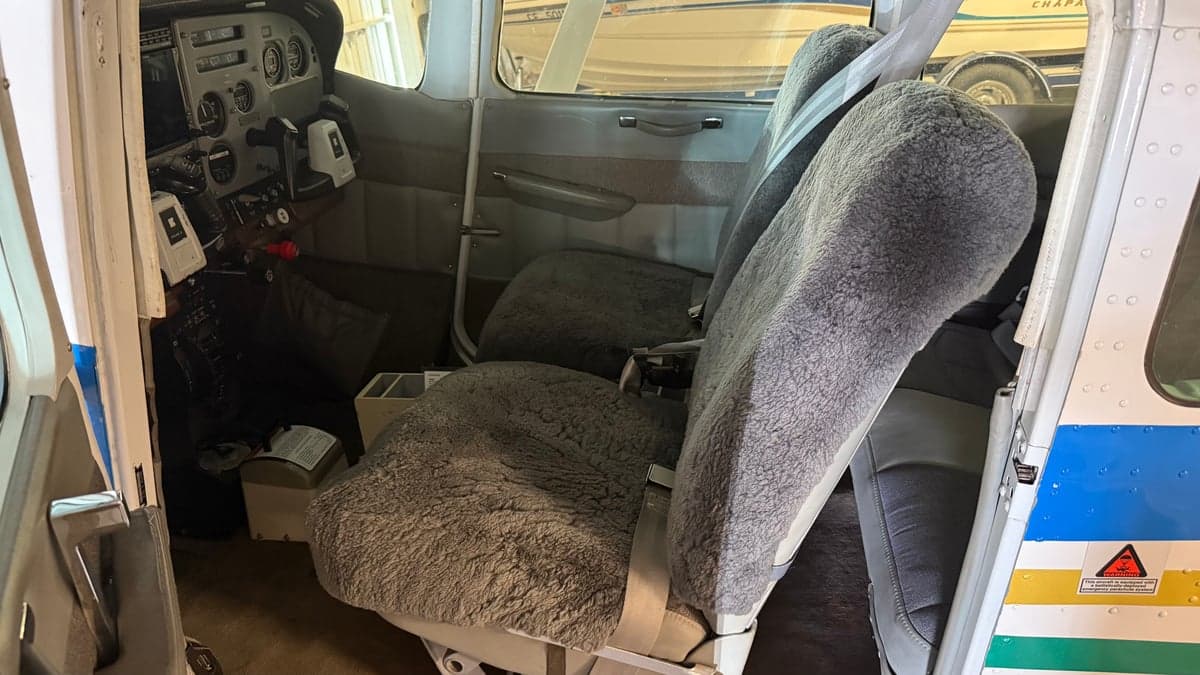 View of the front seats and cockpit from the cabin of N303BS.