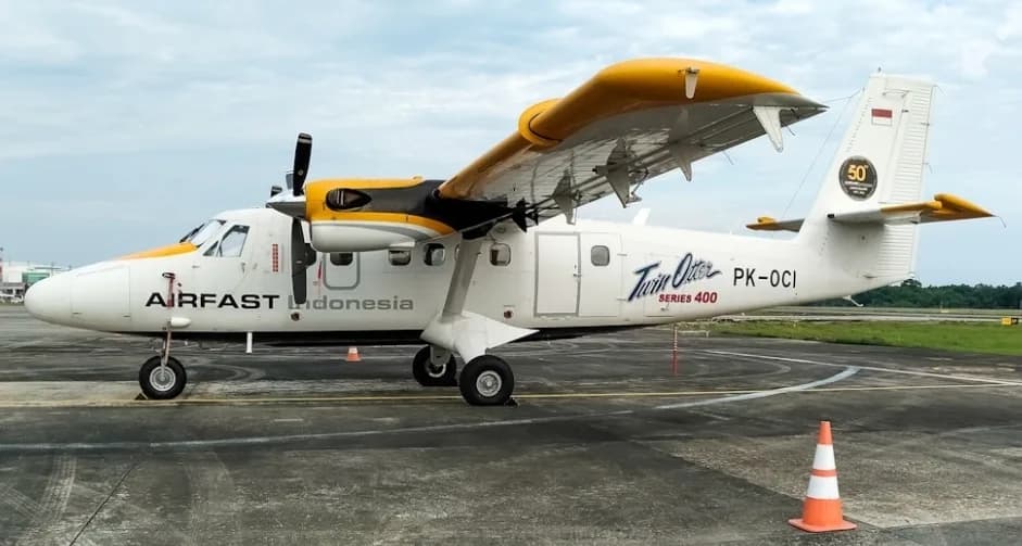 Side view of the PK-OCI Twin Otter Series 400 aircraft on the ground.