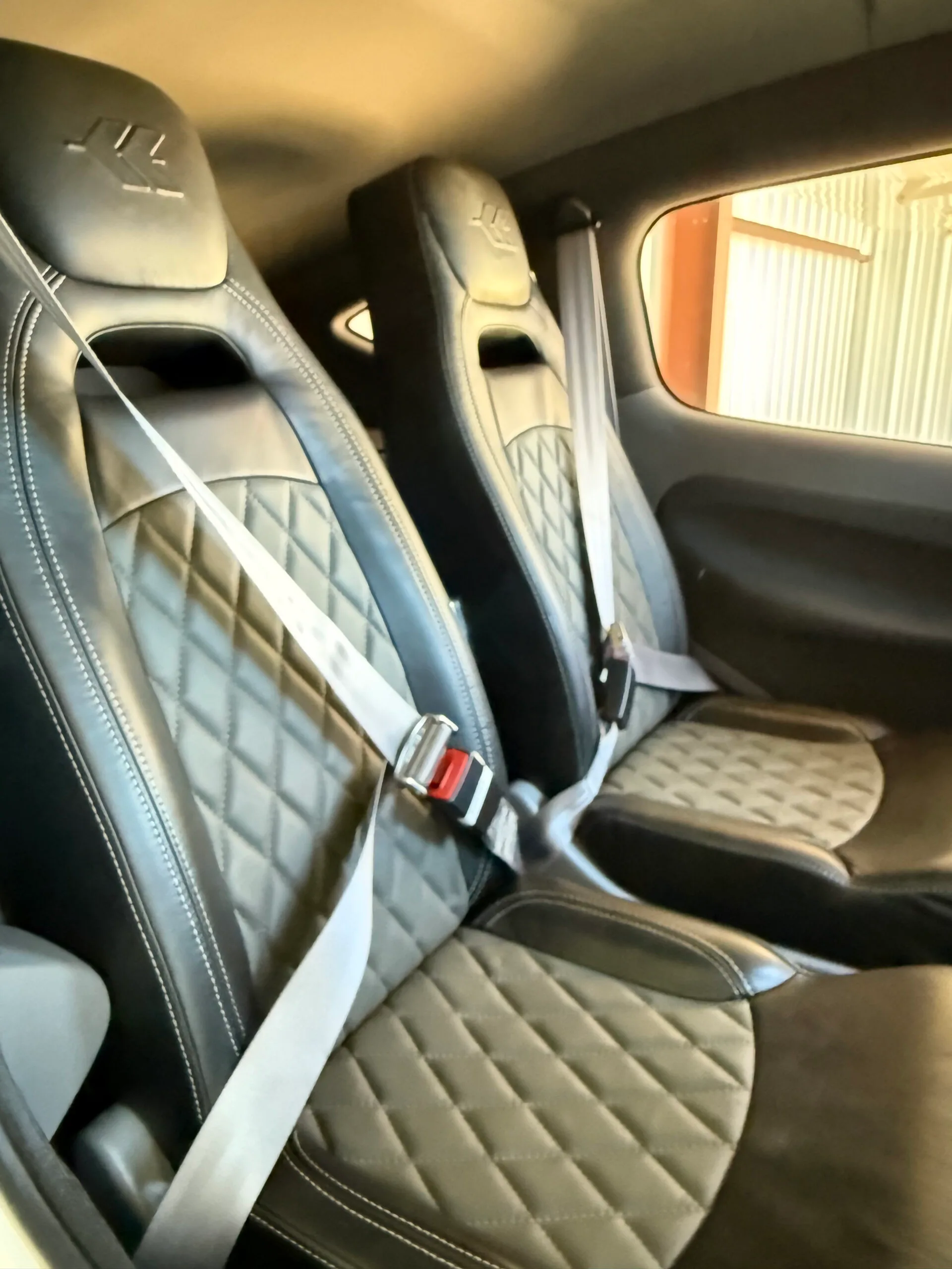 Close-up of the aircraft's front seats with diamond-patterned upholstery.