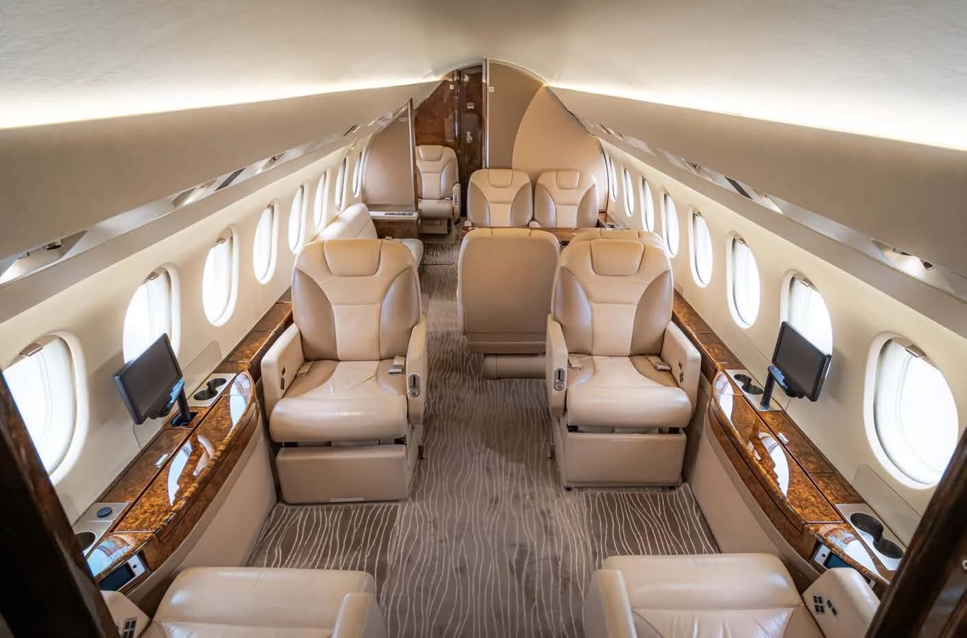 Interior view of the aircraft cabin with leather seats.