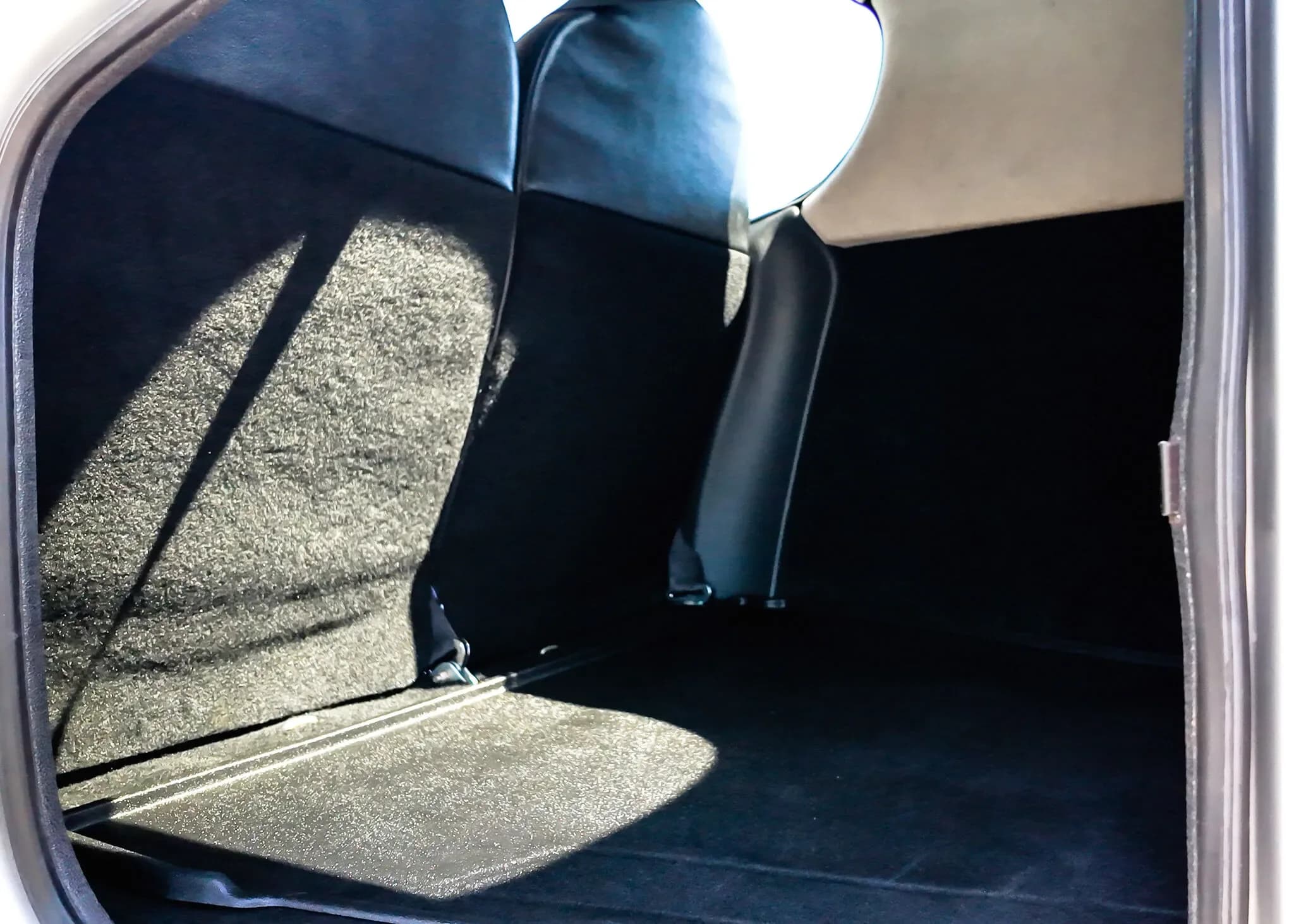 View of the cargo area behind the rear seats in the Cirrus SR22T aircraft.