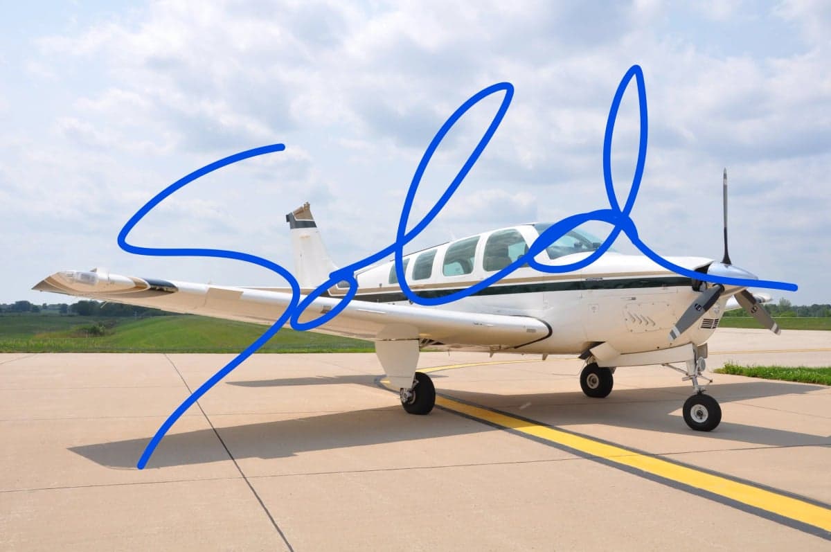 A Beechcraft Bonanza aircraft parked on the tarmac with a SOLD overlay.