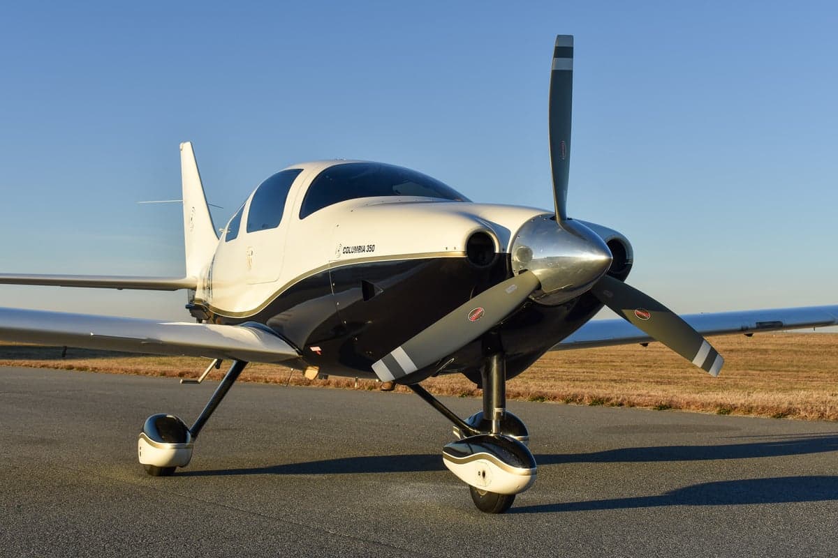 Close-up of the propeller and nose of the Columbia 350 aircraft.