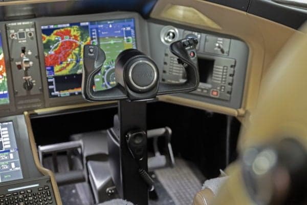 Close-up of the yoke and instrument panel in the cockpit of a Global Express aircraft.