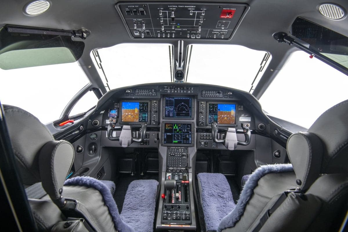Pilatus PC-24 cockpit view showing the instrument panel and seats.
