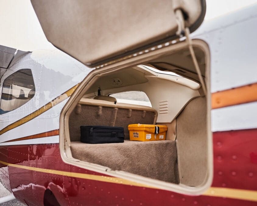 View inside the open baggage compartment of an aircraft.