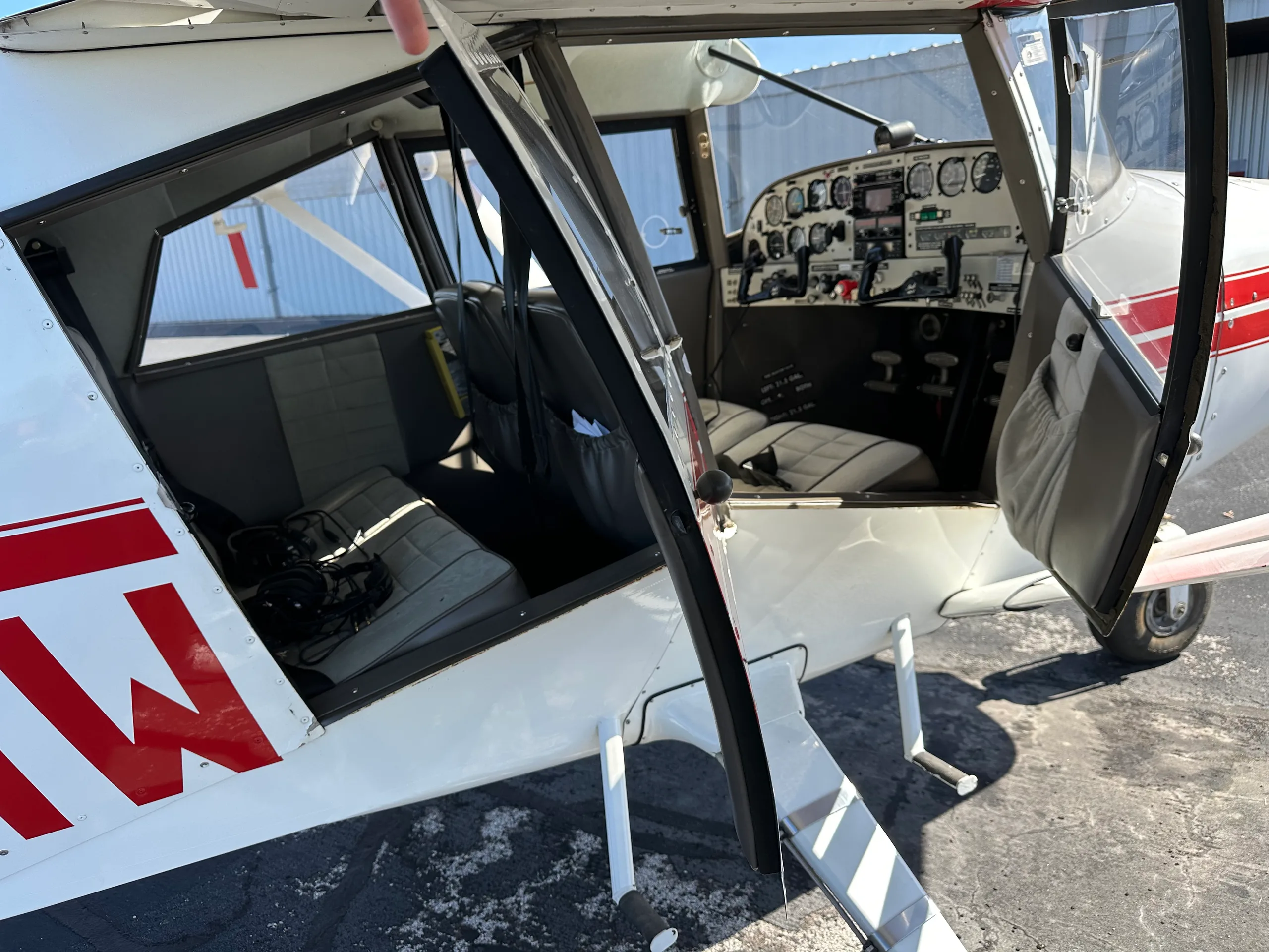 View of the interior of the aircraft, including the seats and instrument panel.