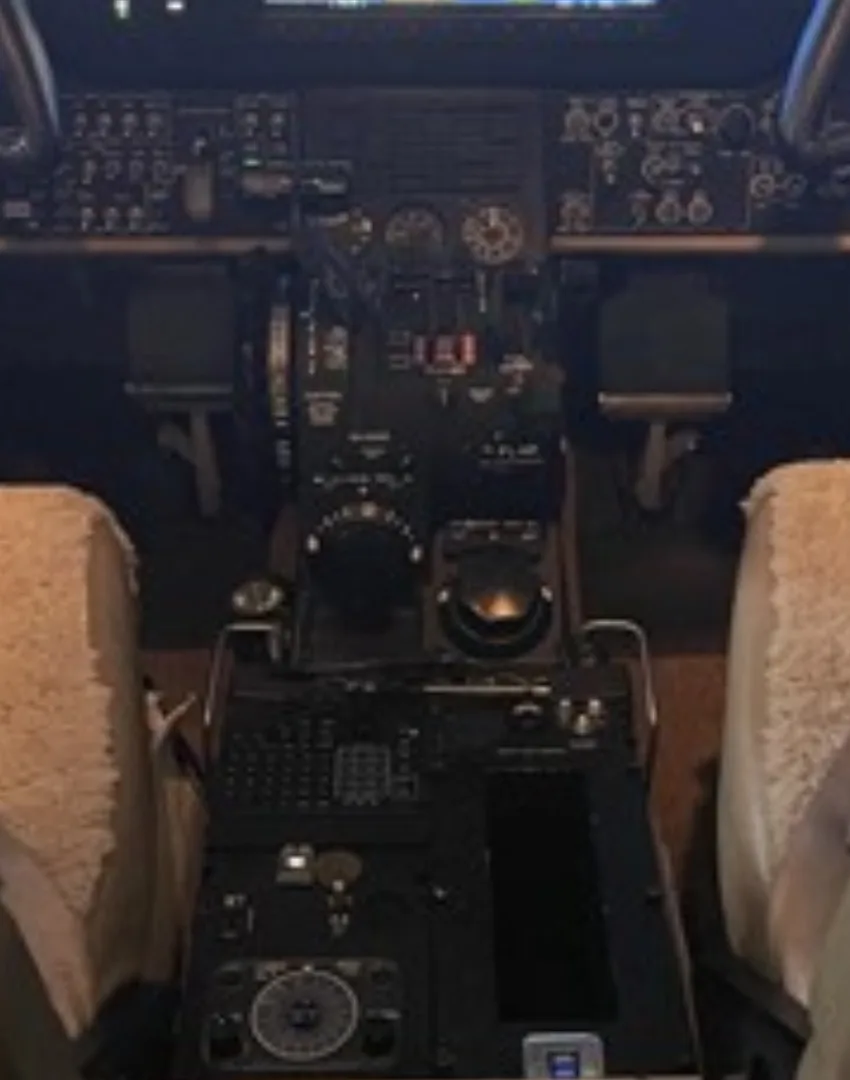A close-up view of the center console and lower instrument panel in a Beechcraft King Air cockpit.