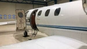 Side view of the Cessna CitationJet OO-IDE with the door open.