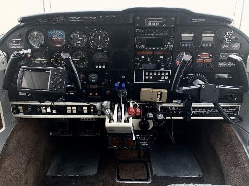 The cockpit features a full instrument panel and controls.