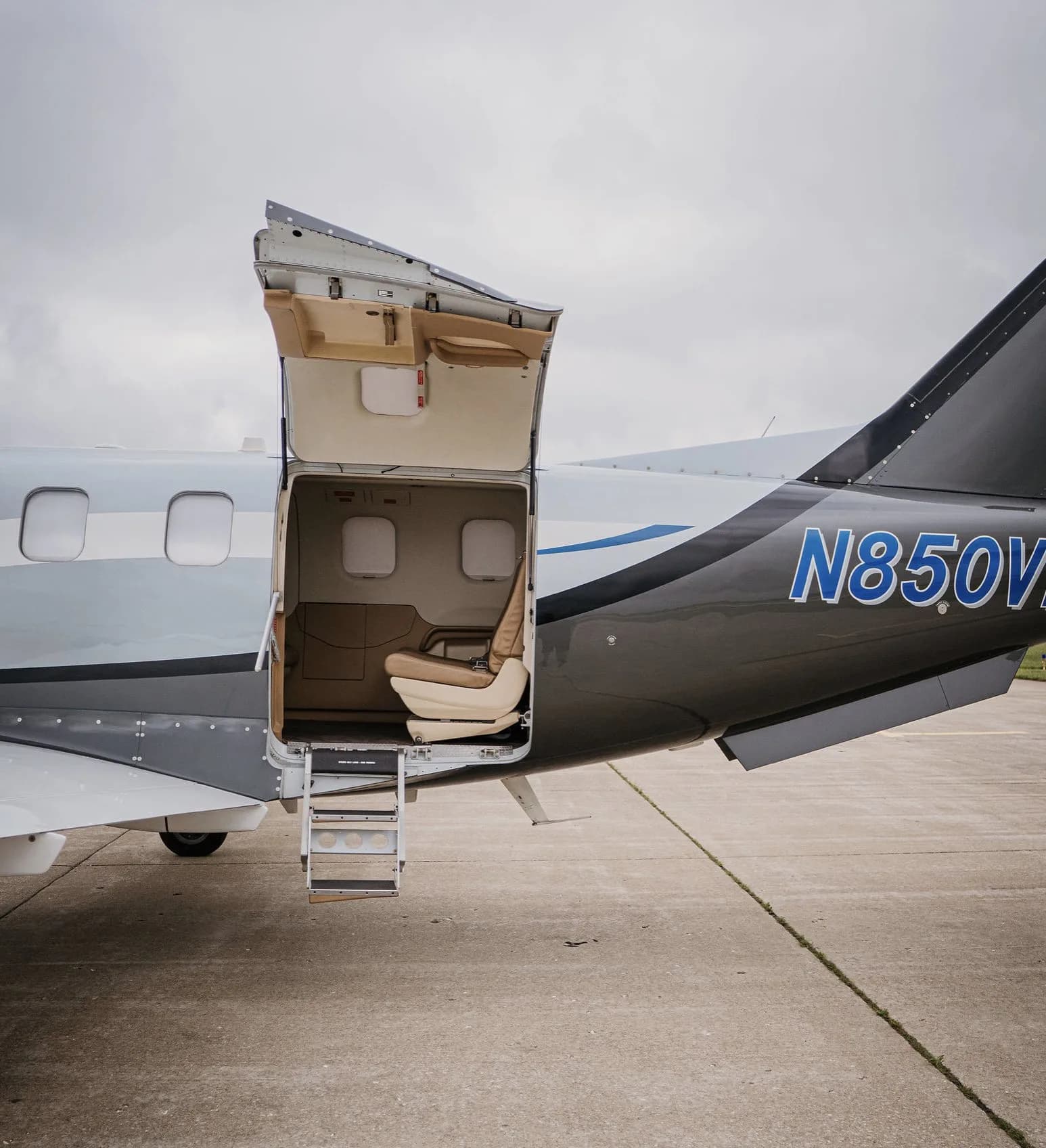 Close-up of the N850VF aircraft's tail and open door with steps.