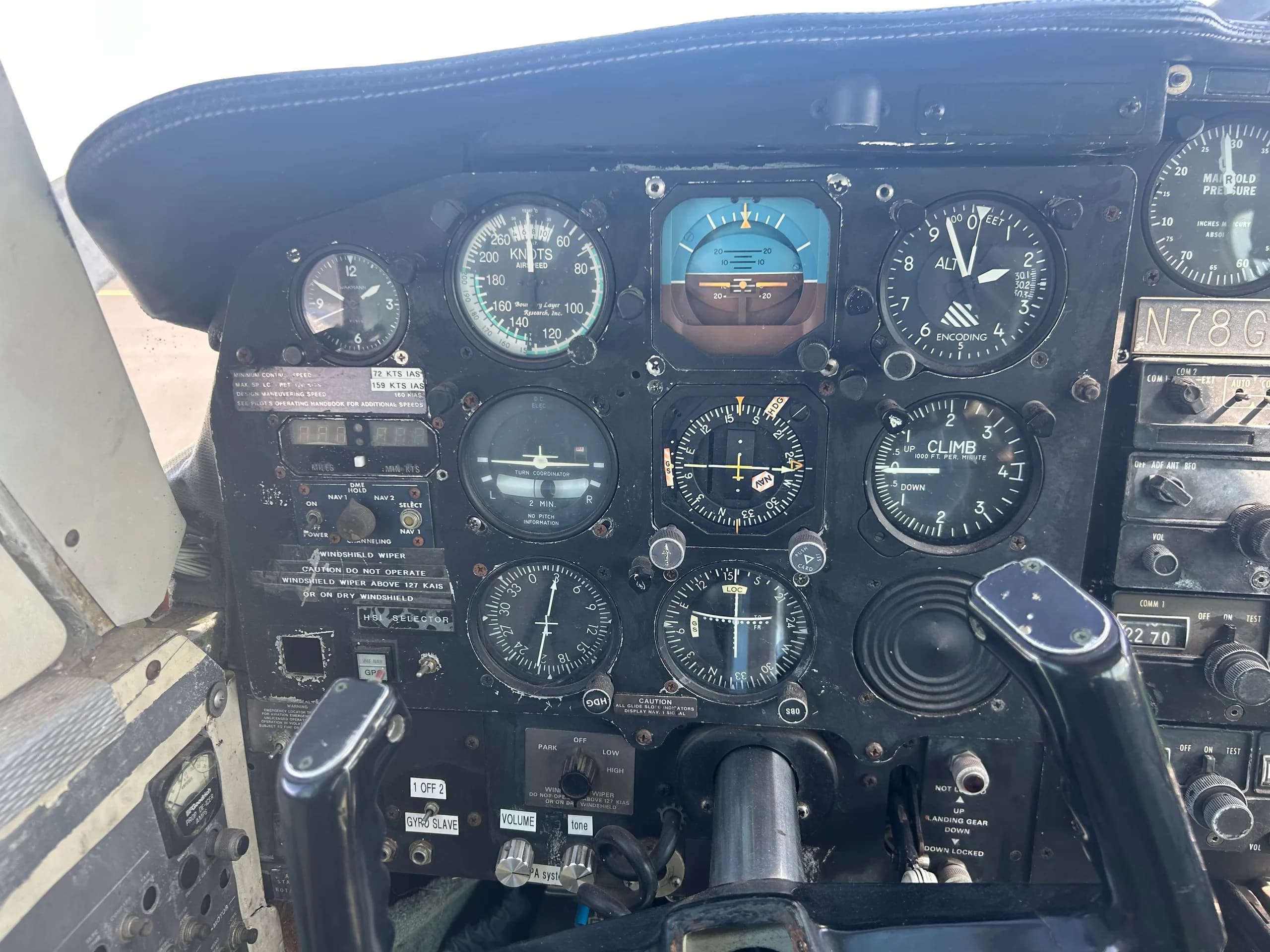 A close-up view of the left side of the cockpit instrument panel in aircraft N78GH, showing flight instruments.