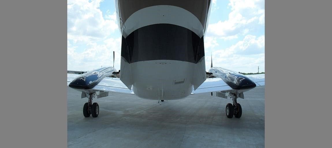 Rear view of a King Air aircraft on the ground.