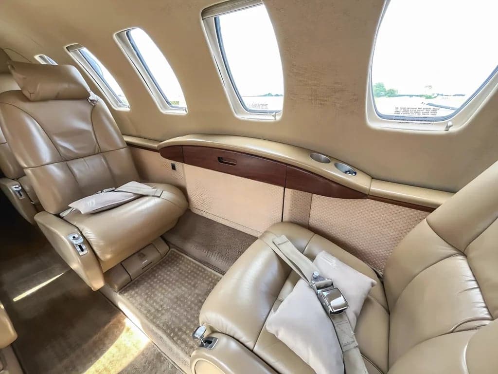A view of the interior cabin of the aircraft, showing the seating arrangement and layout.