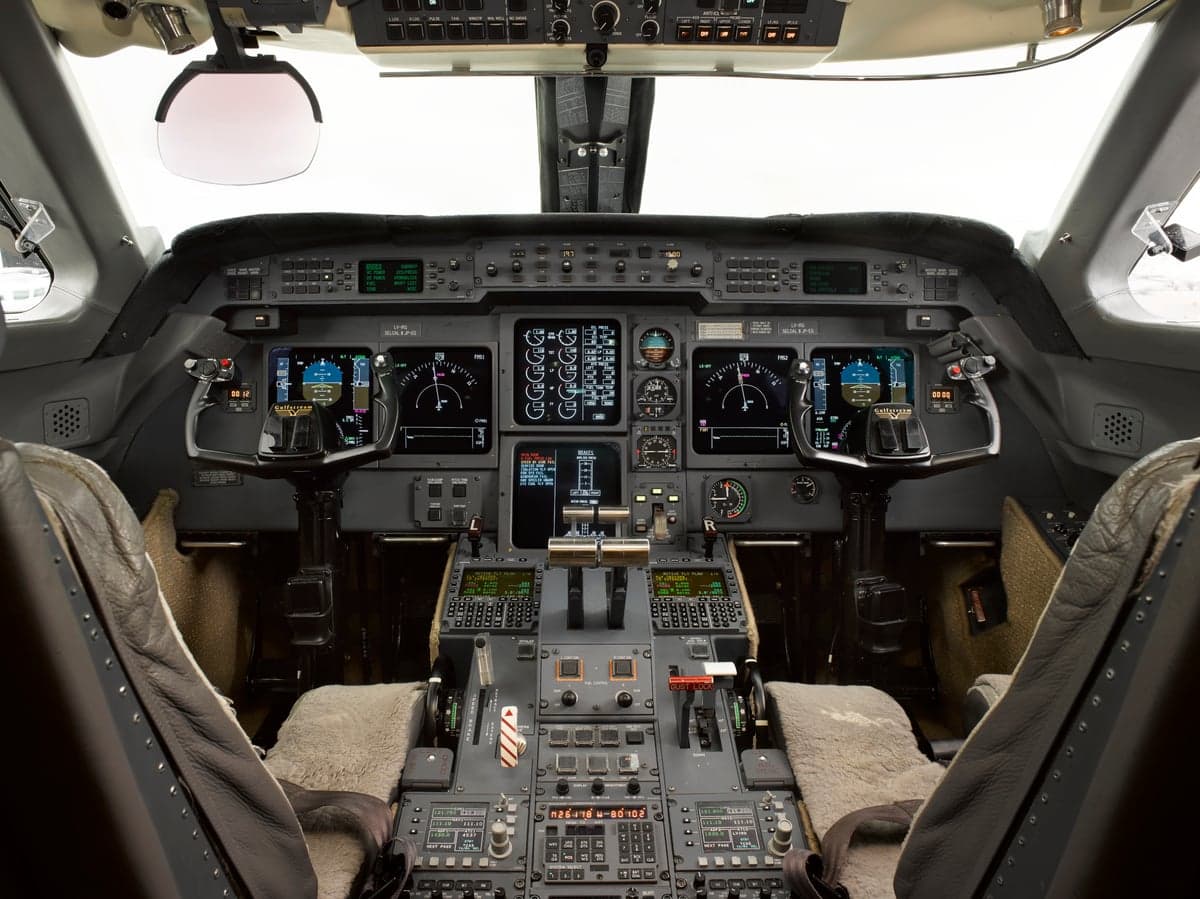 View of the aircraft cockpit instrument panel and controls.