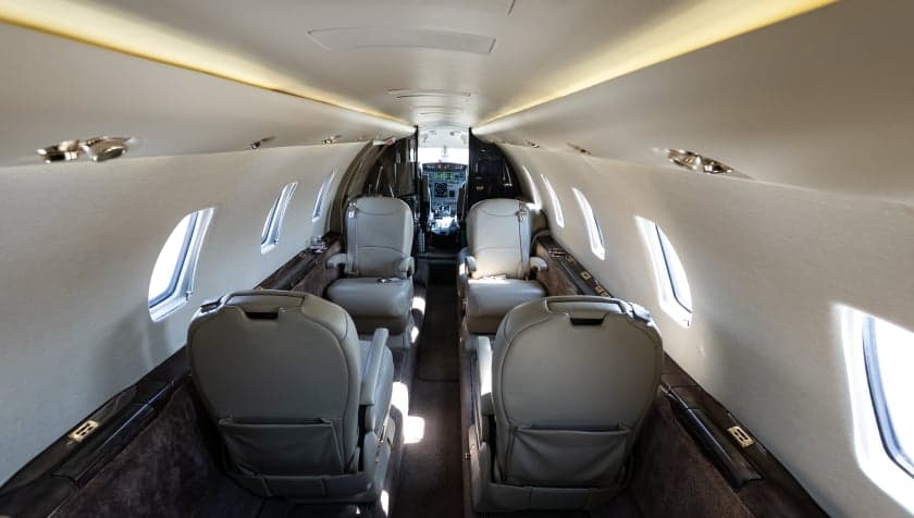 View of the cabin seats in the Cessna Citation CJ3 looking towards the cockpit.