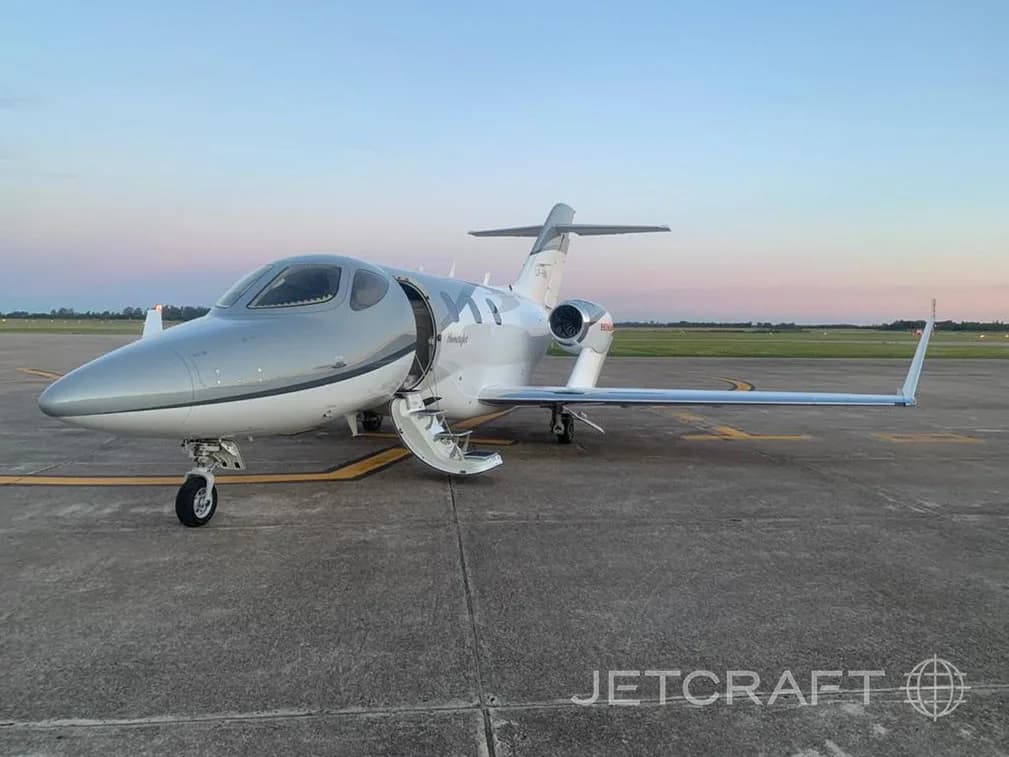 HondaJet on the tarmac with the door open.