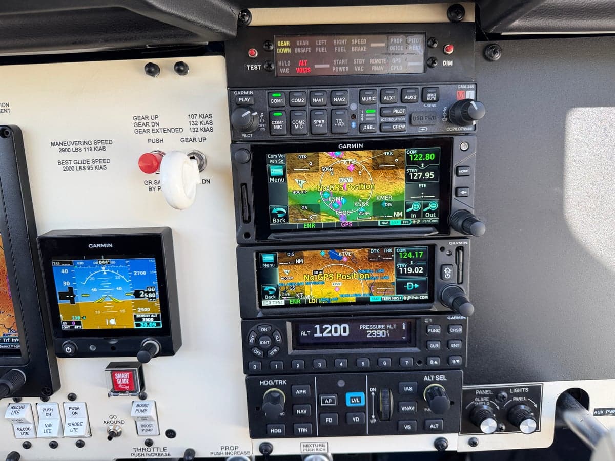 Close-up of the Garmin avionics stack in the Mooney M20J cockpit.