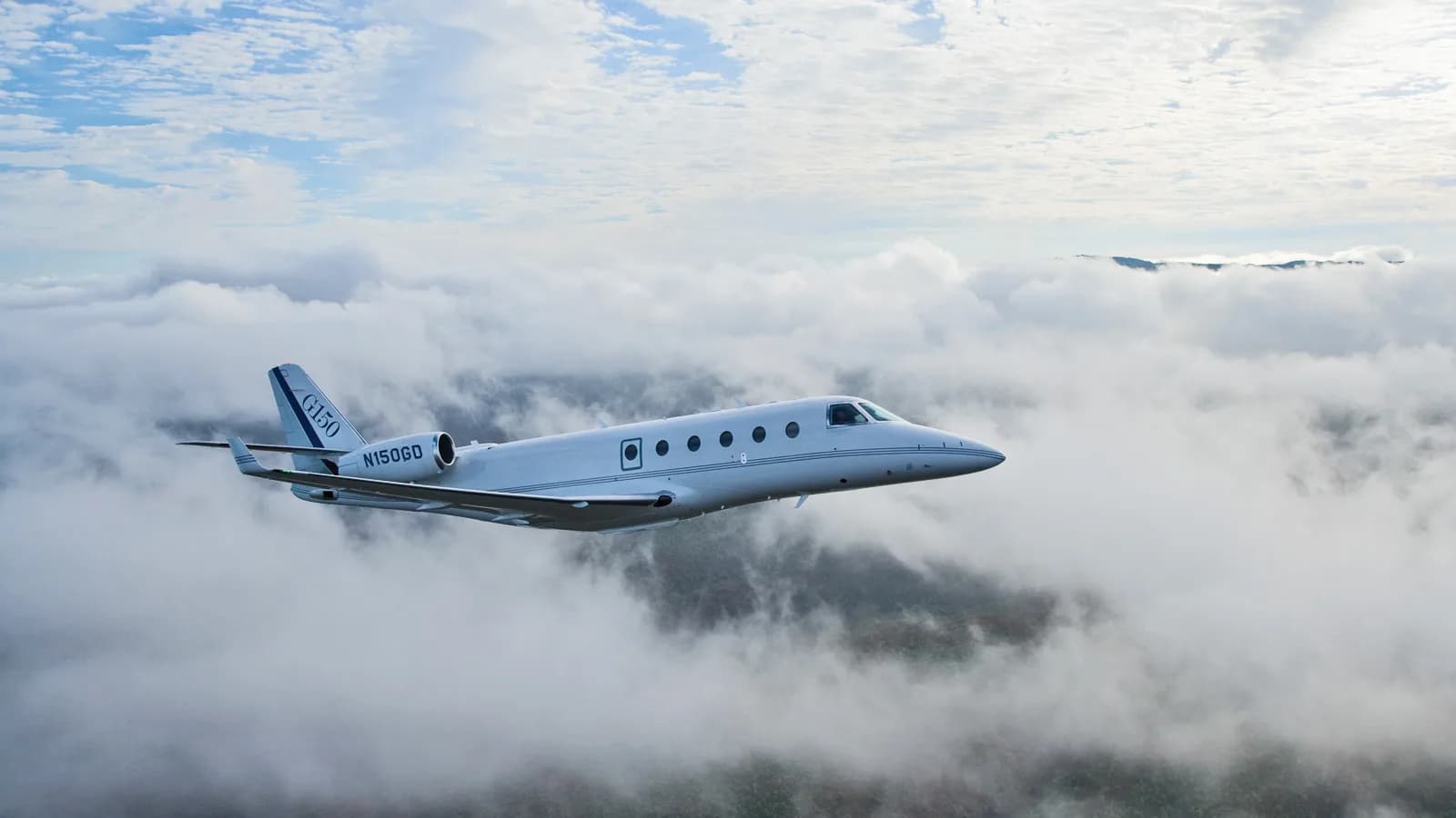 Gulfstream G150 in flight over clouds.