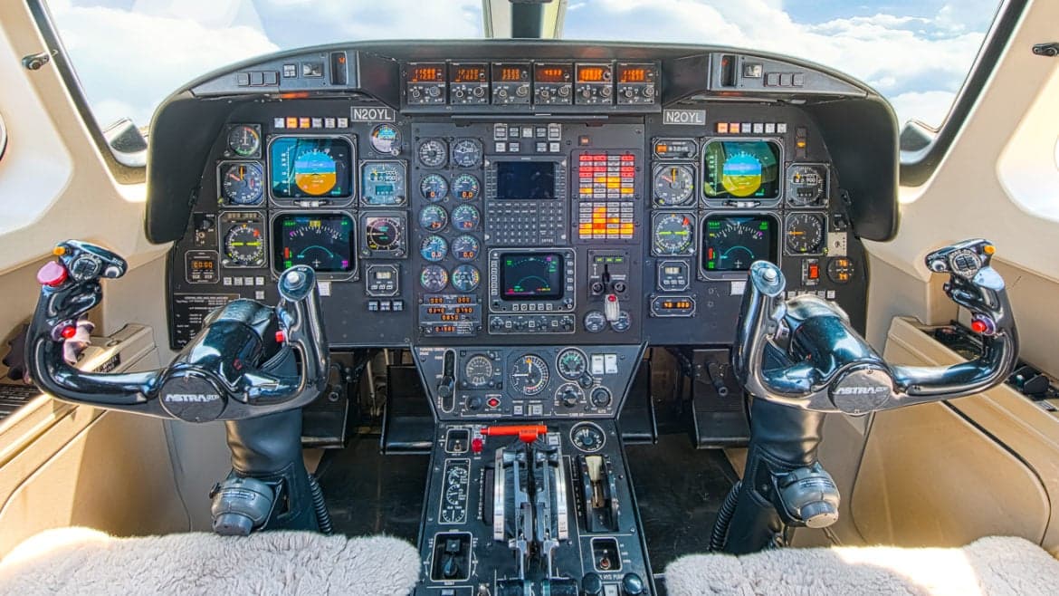Detailed view of the Astra SPX cockpit instrument panel and controls.