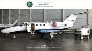 Cessna CitationJet N501SM with the door open in a hangar.