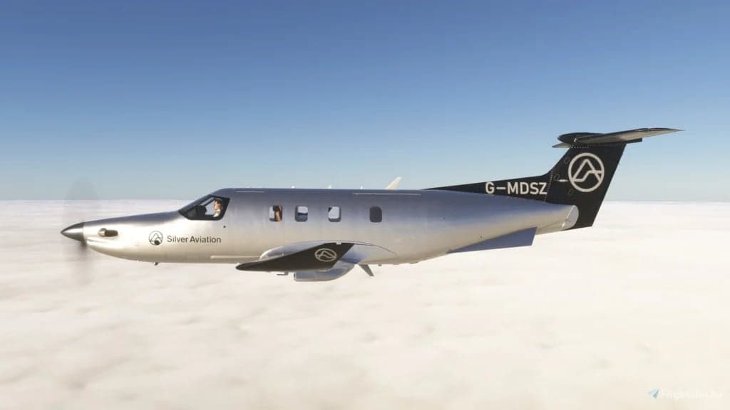 A Pilatus PC-12 aircraft with registration G-MDSZ flying above the clouds.