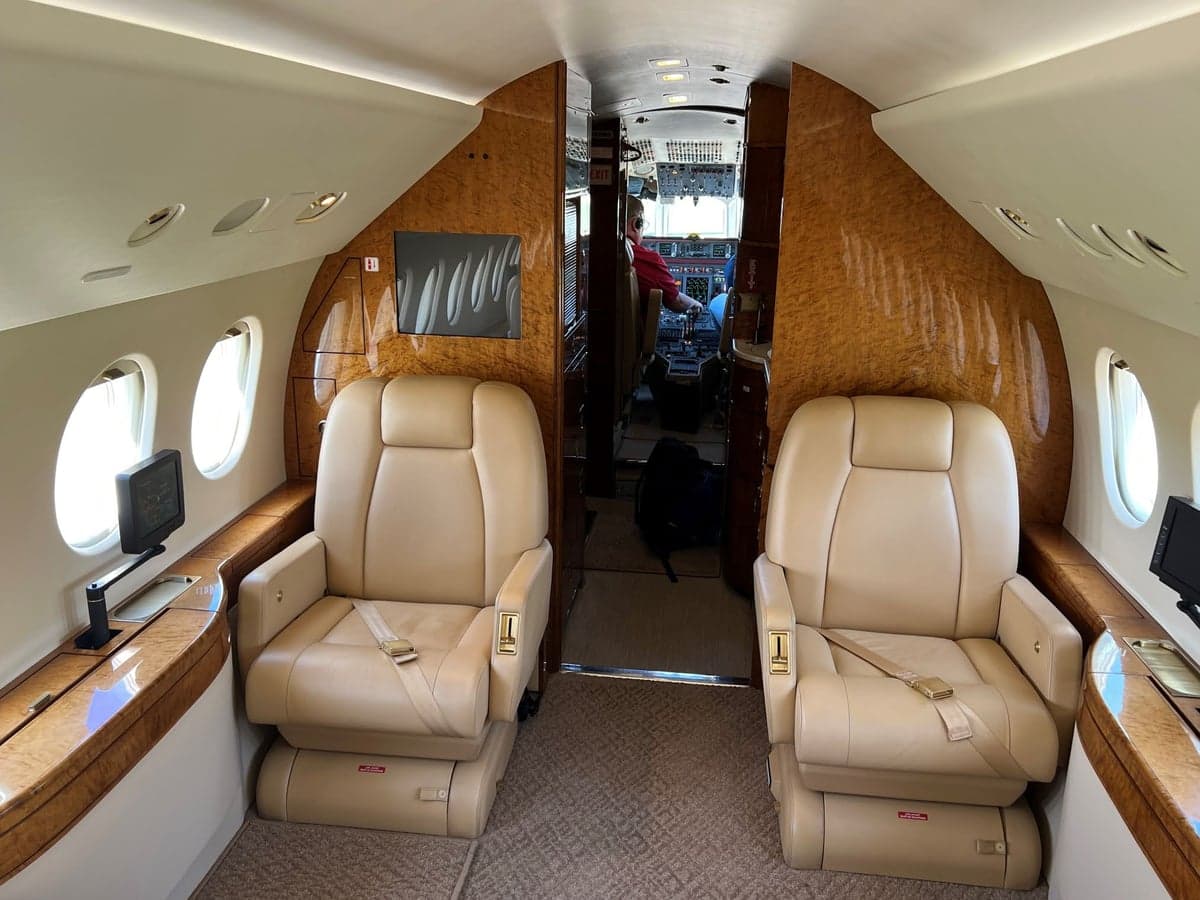 Interior of the aircraft showing a single seat and monitor.