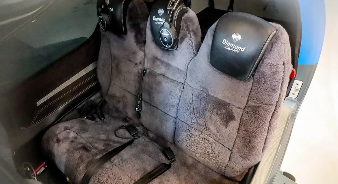 Two aircraft cabin seats covered in gray sheepskin, with "Diamond AIRCRAFT" logos on the headrests.