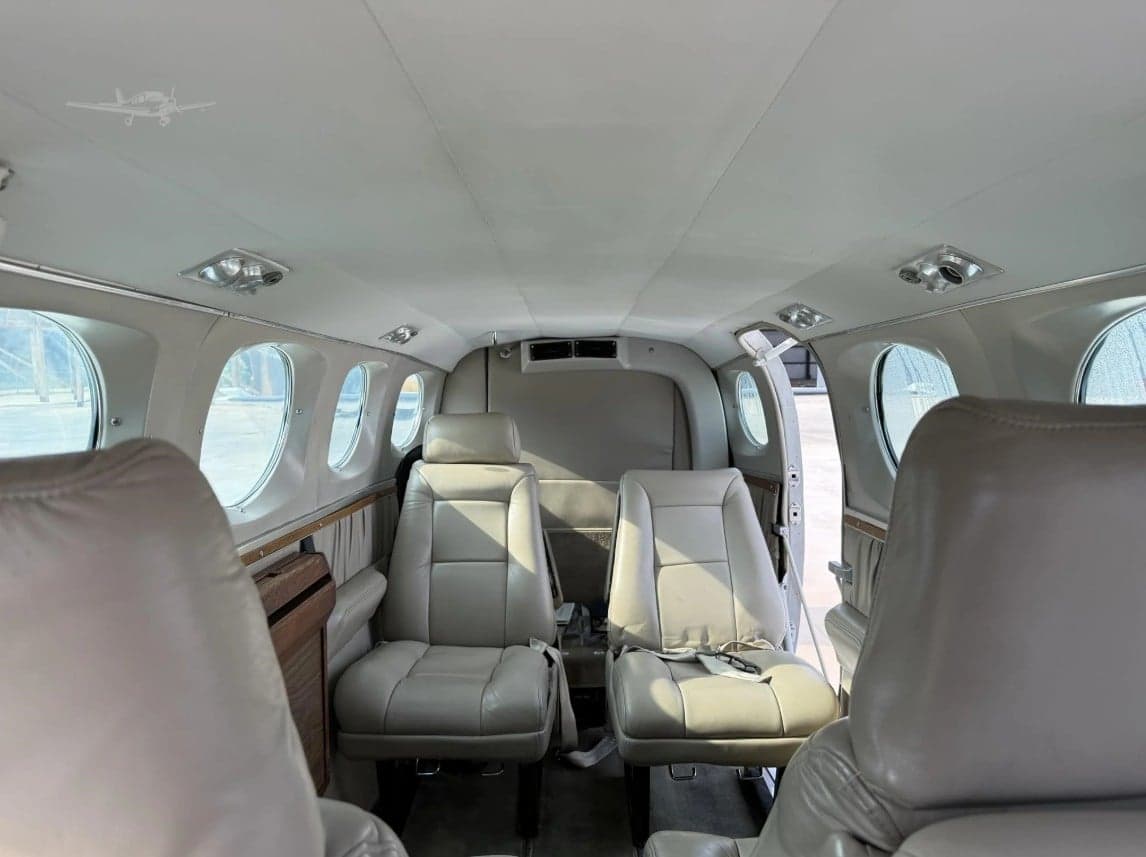 View of the Cessna 340A cabin interior with light gray leather seats.