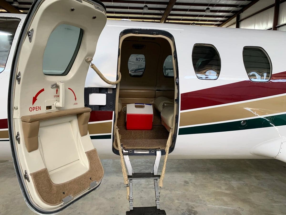 View of the aircraft door and steps leading into the cabin.