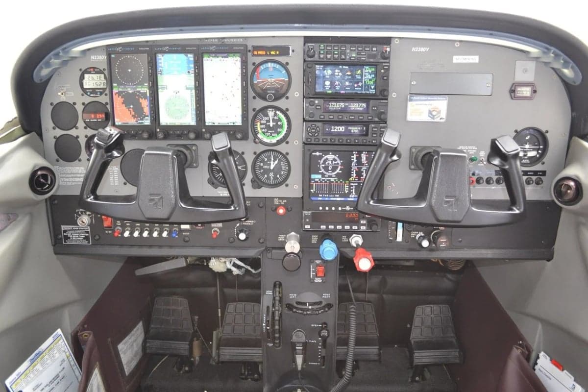 The cockpit of the Cessna Skylane N2380Y features a full instrument panel.