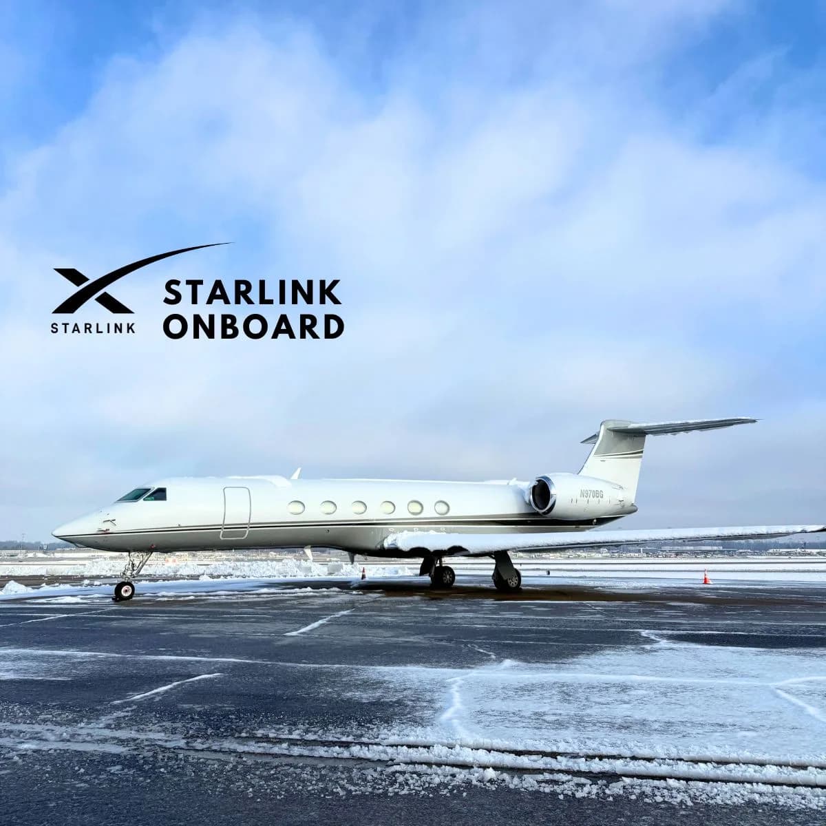 Gulfstream jet with Starlink Onboard logo parked on a snowy tarmac.