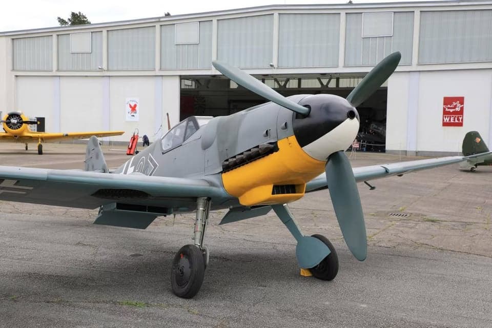 A Messerschmitt Bf 109 parked on the tarmac, front view.