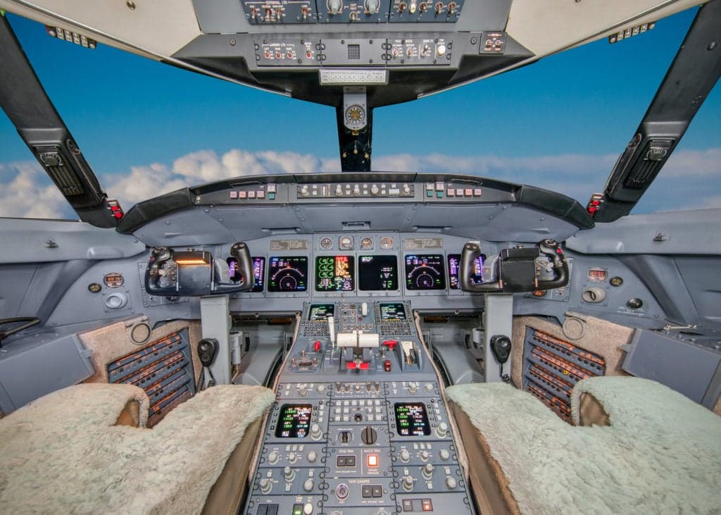 Close up of the engine and fuselage of a Challenger aircraft.