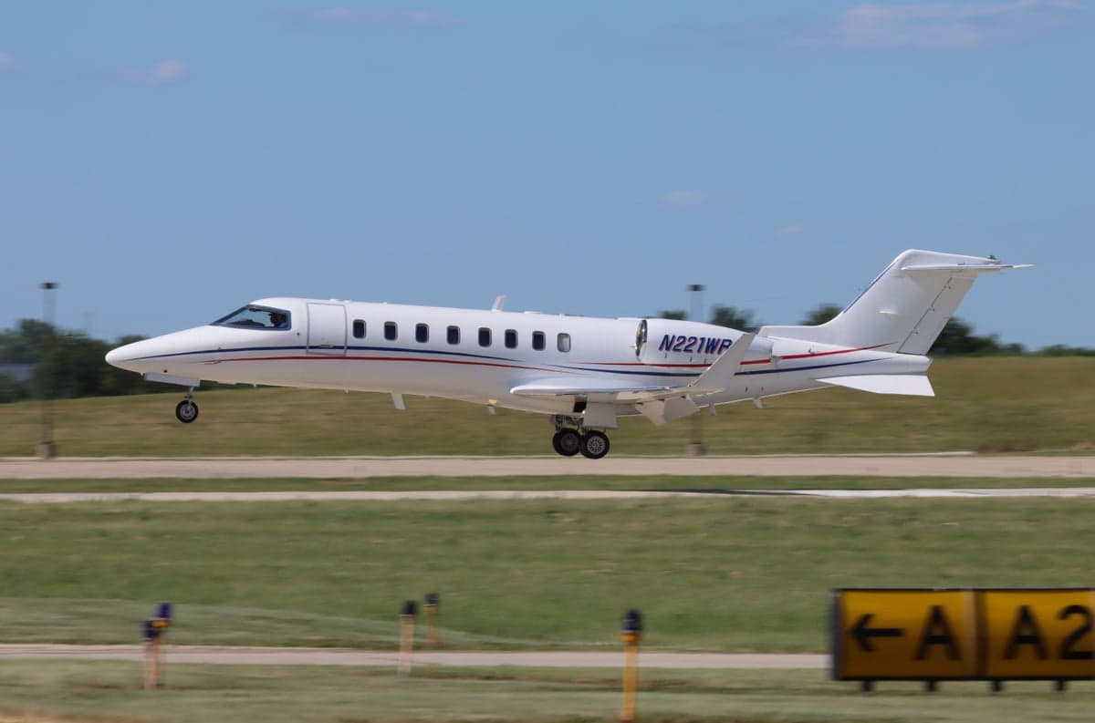 A Learjet 45XR landing on the runway.