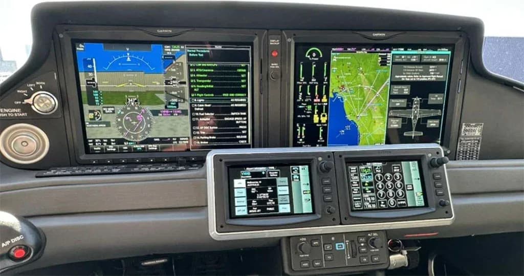 The cockpit of a Cirrus SR22 aircraft, featuring a Garmin G1000 NXi glass cockpit with multiple display screens.
