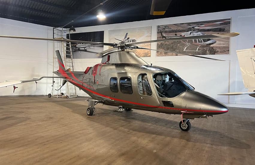 AgustaWestland AW109SP helicopter in a hangar setting.