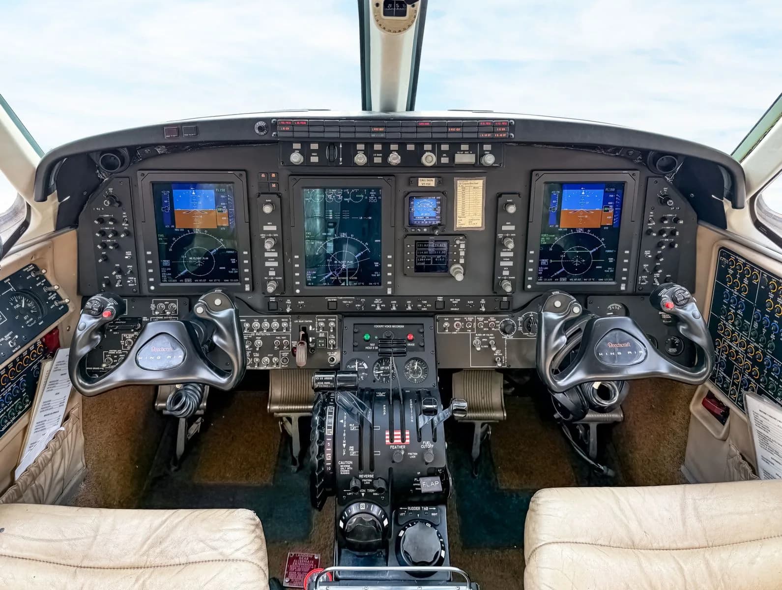 Full instrument panel and controls of the King Air cockpit.