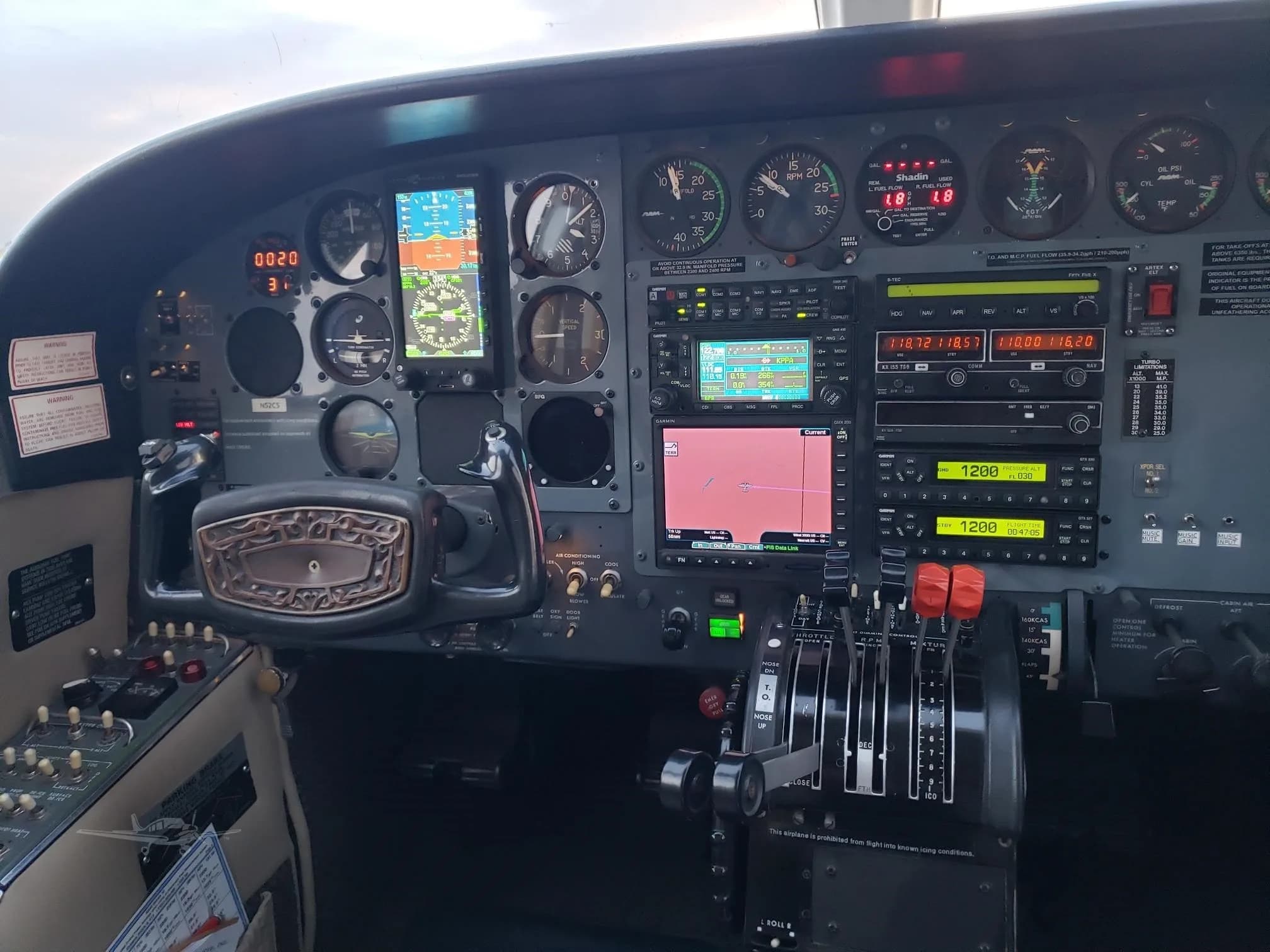The cockpit of the Cessna 414 Chancellor features a variety of instruments and avionics.