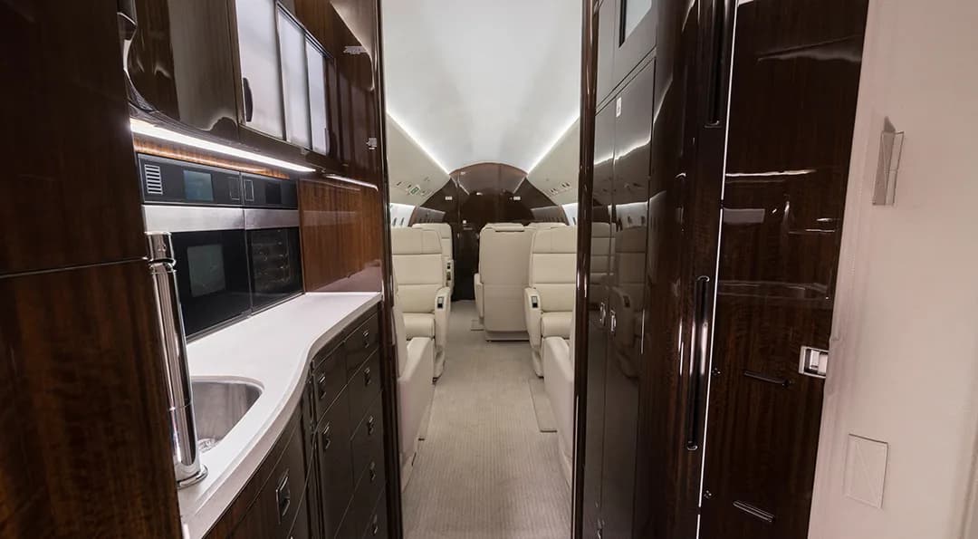 View of the aircraft interior showing the galley and seating area.