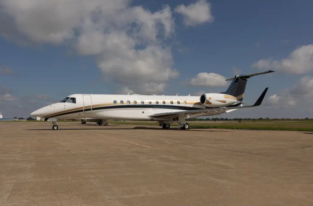 Side view of the Embraer Legacy 650 aircraft on the ground.